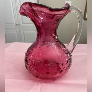 VTG HAND BLOWN CRANBERRY GLASS SINGLE HANDLED JUG WITH HEARTS AND SWIRLS PATTERN